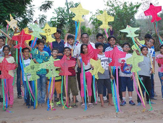 Children learning kite making at a Fly360 workshop, Mumbai Life Festival property expo