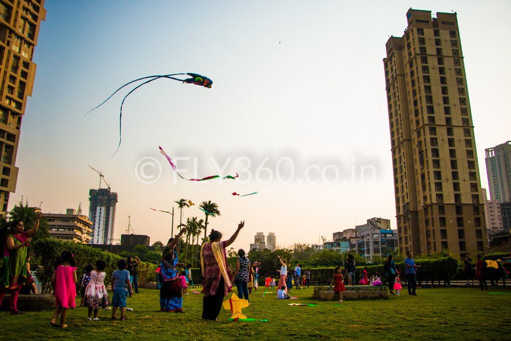 Children flying the kites they built at a Fly360 kite making workshop